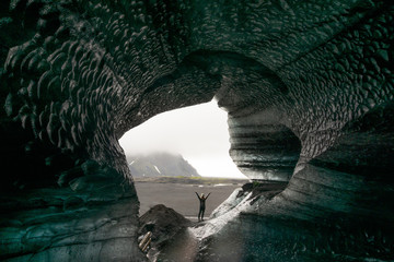 person in ice cave in Iceland
