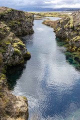 rocks in the river between two tectonic plates in Iceland