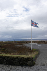 iceland flag on traditional landscape