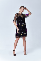 Beautiful sexy young business woman blond hair with evening make-up wearing a dress suit top and high-heeled shoes  business clothes for meetings and walks autumn collection perfect body shape.