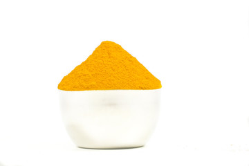 Turmeric powder isolated on a white background