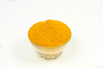 Turmeric powder isolated on a white background