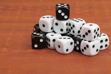 Dice on a wooden table. Concept for business risk.
