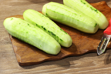 Cucumber on a cutting board. Cook food. Food in the kitchen