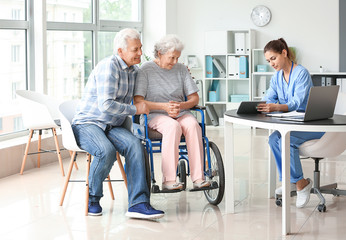 Elderly people with caregiver in nursing home