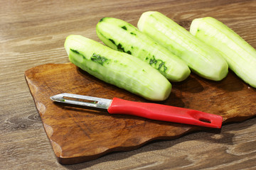 Cucumber on a cutting board. Cook food. Food in the kitchen