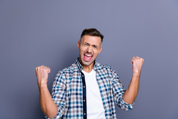 Portrait of his he nice attractive cheerful cheery glad overjoyed bearded guy wearing checked shirt rejoicing satisfactory isolated over blue violet purple pastel background