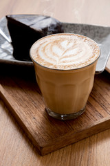 Hot Latte, Latte Art Pattern, Beautiful with cakes on a wooden table