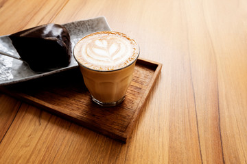 Hot Latte, Latte Art Pattern, Beautiful with cakes on a wooden table