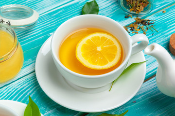healthy herbal tea over blue background