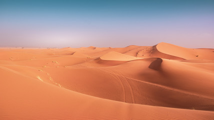 Landscape view of yellow sand and clear blue sky. Sahara, Morocco.