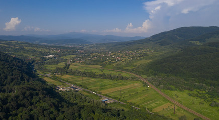 Aerial view of the Carpathian mountains. Natural background with geometric pattern - beige and red...