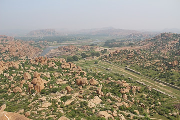 View of the unusual stone landscape and the ruins of Hampi from the hill Matanga. Sacred Center. Karnataka, India.