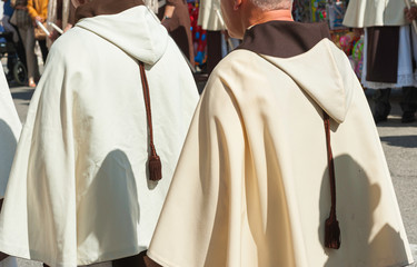 dress detail religious brotherhoods parading in a procession in celebration saint patron on apulia, Italy