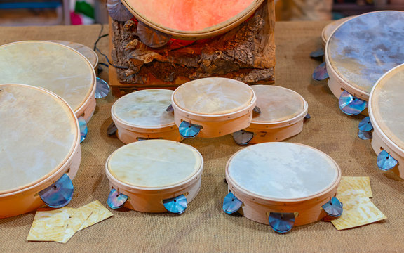 Typical small handmade Salento tambourines for sale on a stall during a festival