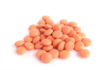 orange tablets on white background. Epidemic, painkillers, healthcare, treatment pills and drug abuse concept. top view. flatlay