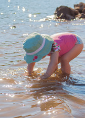 little girl playing in the water