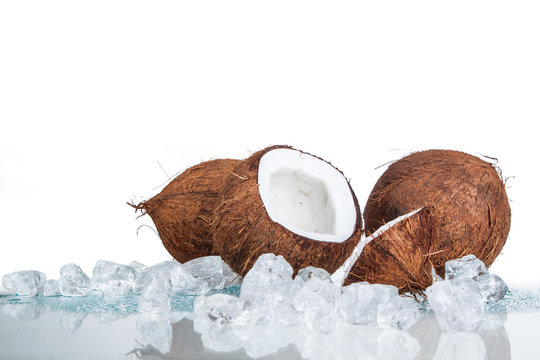 coconut with ice cubes on a white background