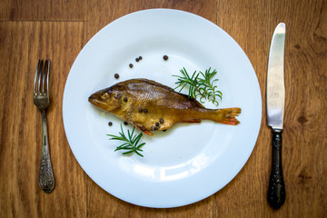 smoked flavored fish on a plate with spices