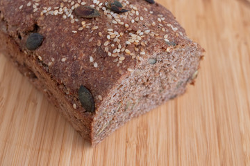 Rye bread loaf with pumpkin seeds and sesame seeds on a cutting