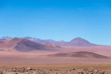 Fototapeta na wymiar Background with barren desert scenery in the Bolivian Andes, in the Nature reserve Edoardo Avaroa