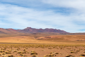 Fototapeta na wymiar Background with barren desert scenery in the Bolivian Andes, in the Nature reserve Edoardo Avaroa