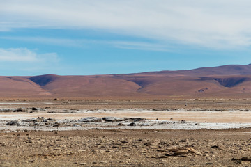 Background with barren desert scenery in the Bolivian Andes, in the Nature reserve Edoardo Avaroa