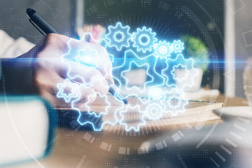 International business hud over woman's hands writing background. Concept of hard work. Double...