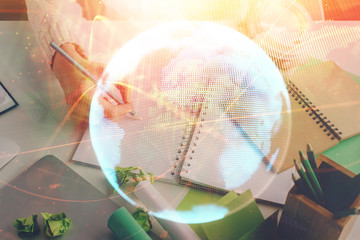 International business hud over woman's hands writing background. Concept of hard work. Double...