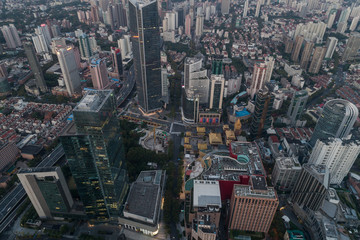 Fototapeta premium Aerial view of business area and cityscape in the dawn, West Nanjing Road, Jing` an district, Shanghai