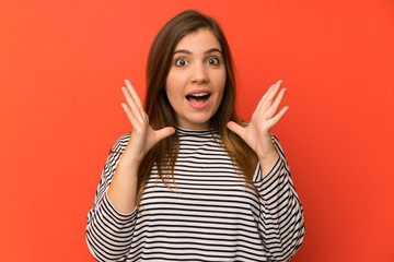 Young girl with striped shirt with surprise facial expression