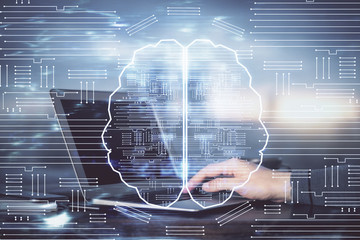 Man typing on keyboard background with brain hologram. Concept of big Data. Double exposure.