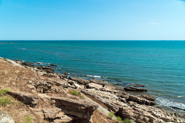 Fototapeta na wymiar Sea coast with a rocky shore