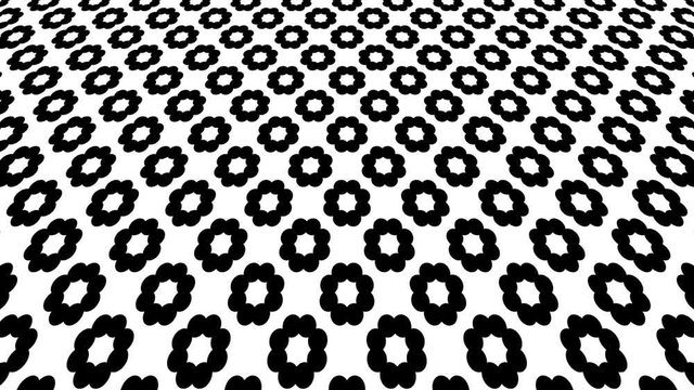 Black and white graphic pattern with geometric figures, which moves on a vertical inclined plane, moves from the bottom up to the top on a black background.