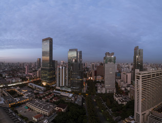 Fototapeta premium Aerial view of business area and cityscape in the dawn, West Nanjing Road, Jing` an district, Shanghai