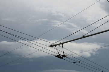 Trolley bus street wire line with clouds on background