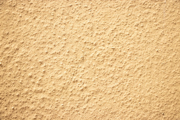 Beige painted grunge wall rough texture