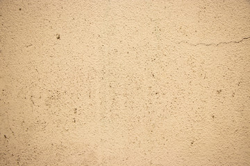 Beige painted grunge wall rough texture