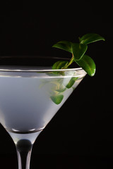 part of the glass of cocktail white lady on a black background
