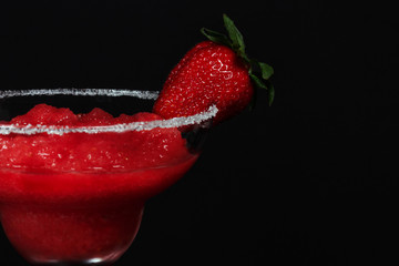 glass of daiquiri and juicy fresh strawberries