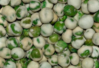 Macro image of Wasabi Peas, a hot snack of roasted peas and other ingredients including fiery Wasabi. They have fiber but a fairly high calorie count.