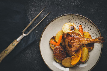 Roasted Goose Leg with Potatoes, Carrots and Oranges