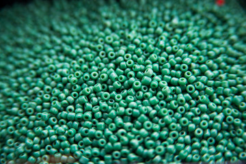 Lots of colorful fusible plastic beads used for arts and craft. Decoration for wallpaper desktop, poster, cover booklet, card.