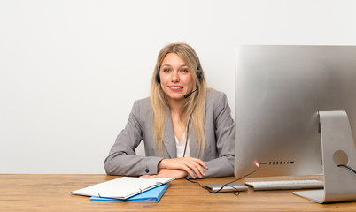 Young woman working with headset having doubts and with confuse face expression