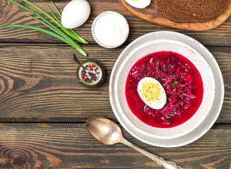 Beetroot soup. Holodnik. Cold summer vegetarian dish of bees, cucumbers, potatoes, eggs, green onions, dill and parsley with kefir or sour cream. Traditional Lithuanian (ukrainian, russian) cuisine