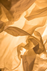 Warm light through pleated paper