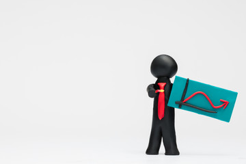 A man made from plasticine holding a graph with an arrow pointing up on white background, aligned to the right.