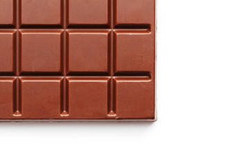 Square-shaped milk chocolate on a white background from above. Isolated A whole plate of dark chocolate isolated on white from above