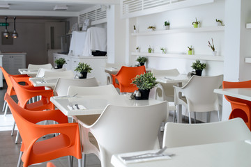 street cafe interior, outdoor wooden tables and chairs. Horizontal frame