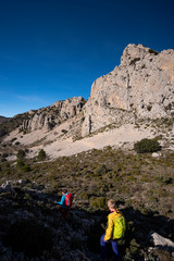 Two women hiking in Sierra de Serrella, Quatretondeta-Confrides, Alicante province, Comunidad Valenciana region, Spain